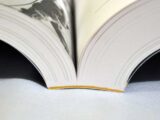 Shows an example of perfect binding of a soft cover book